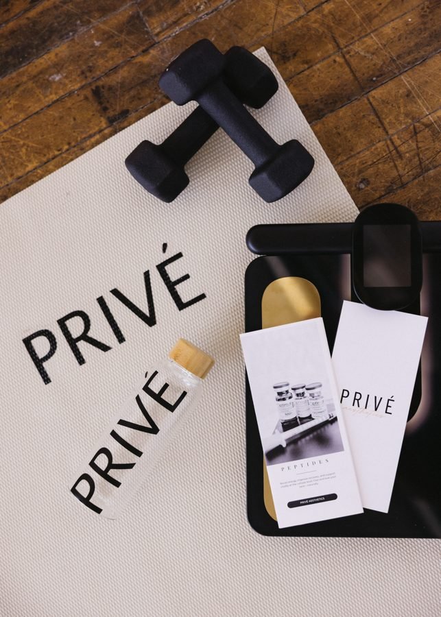 Privé Aesthetics — clinician drawing a peptide preparation from a compounded vial, all medications sourced from a U.S. licensed compounding pharmacy