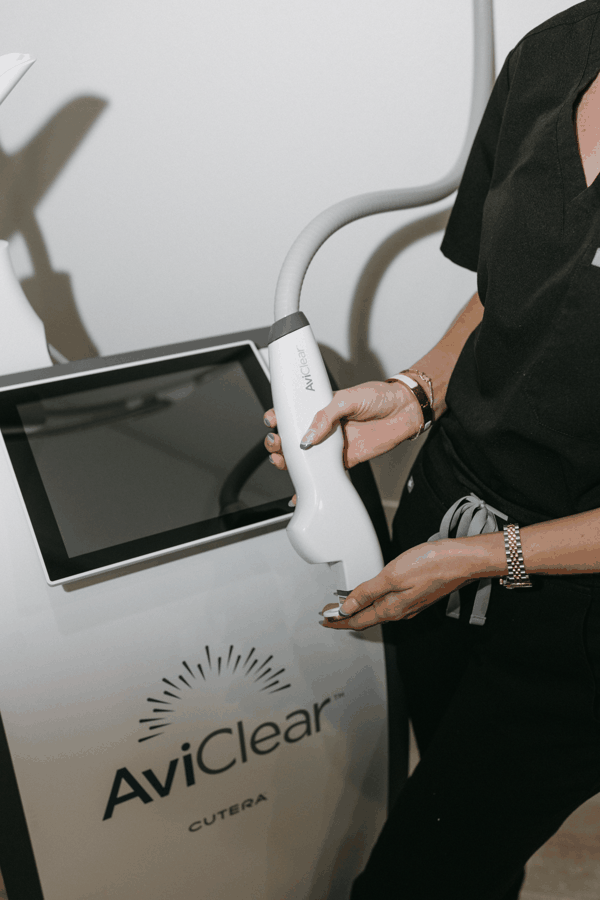Privé Aesthetics — laser handpiece in use at the Hillcrest studio