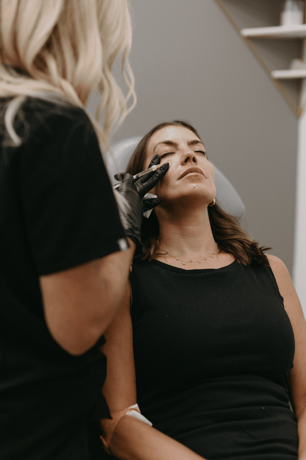 Elizabeth Hurley, RN BSN CANS, treating a real Privé client at the Hillcrest studio — the same studio where blood is drawn, processed, and reinjected for PRP and PRF